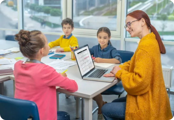 Teacher working with a small group of kids